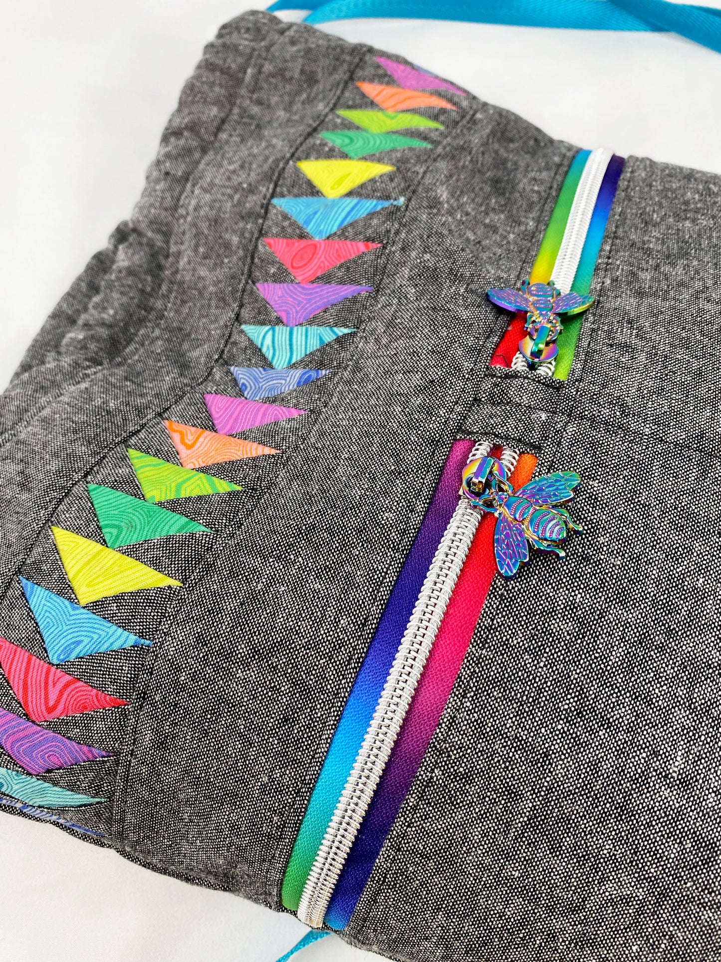 Begonia Backpack in Rainbow Flying Geese on Charcoal Essex with Aqua cork