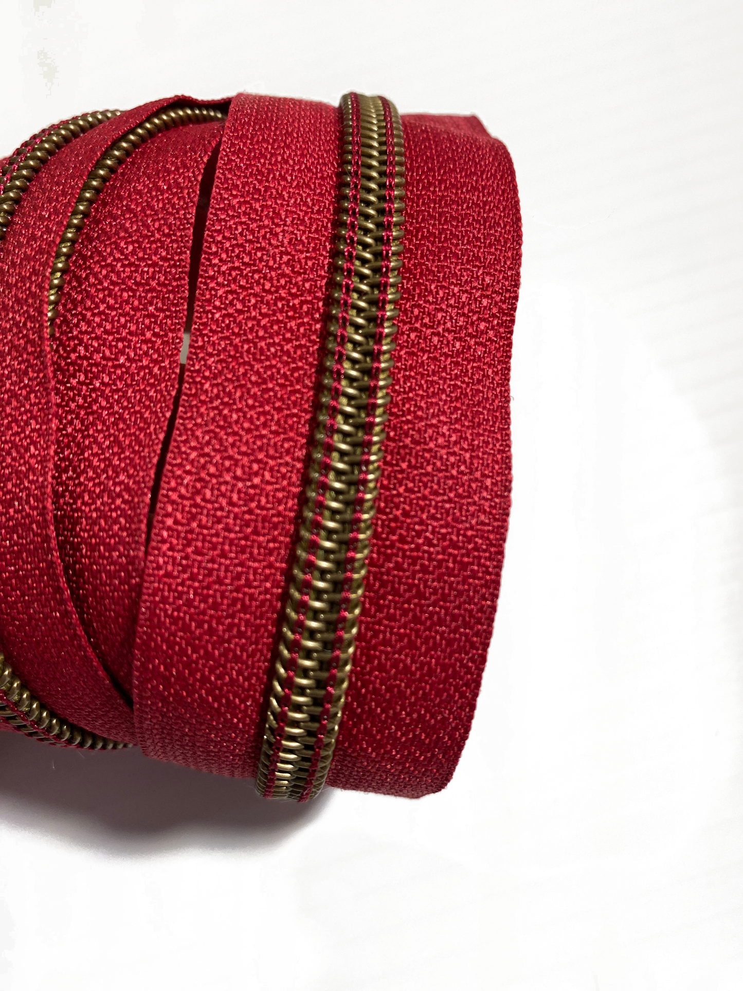 ANTIQUE BRASS COIL - CHERRY RED - #5 Metallic Nylon Coil Zipper tape
