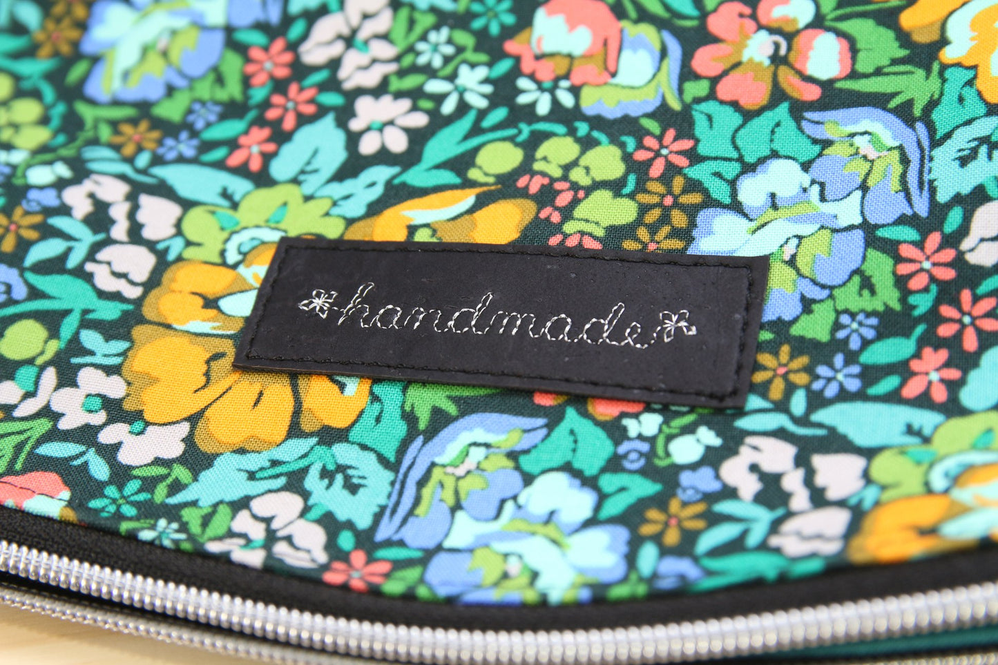 Freesia Foldover Bag in Anna Maria Floral on black with black cork