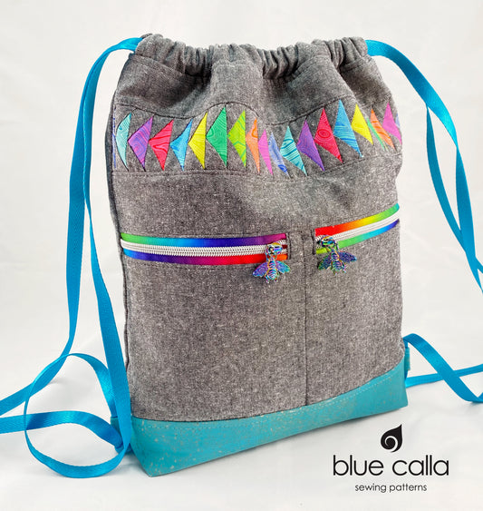 Begonia Backpack in Rainbow Flying Geese on Charcoal Essex with Aqua cork