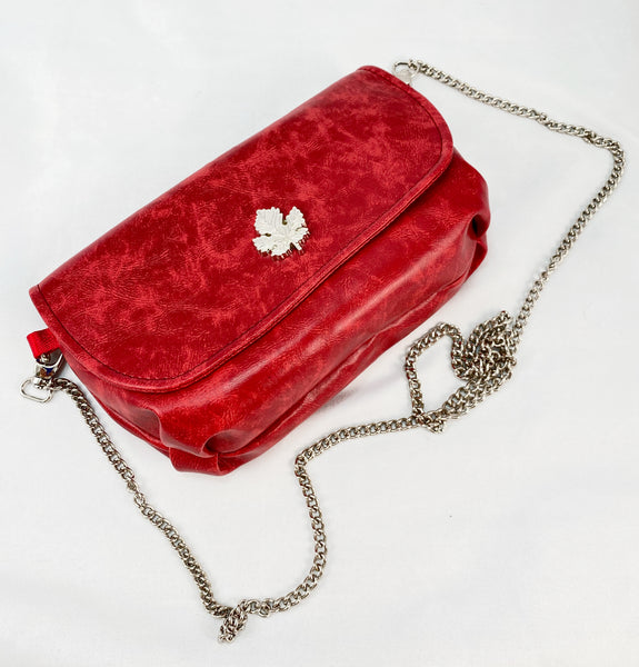 Evening bag in Red Faux Leather with maple leaf lock and chain strap