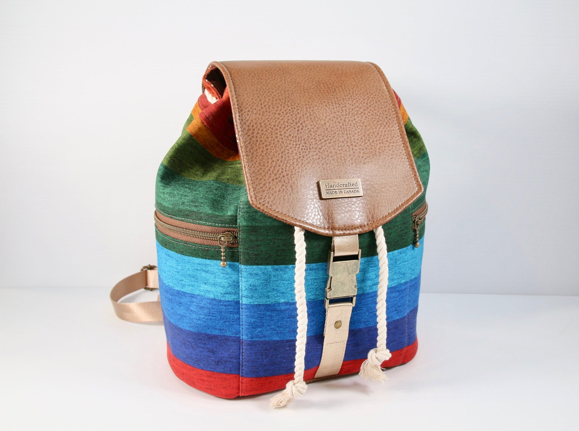 Drawstring Backpack in Rainbow Stripe Canvas and Brown Faux